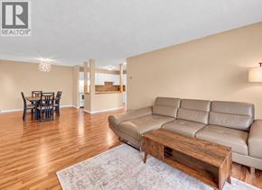Maple Ridge apartment for rent - A living room with a brown leather couch and a wooden coffee table.