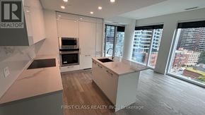 Toronto (Church-Yonge Corridor) condo for rent - A modern kitchen with a view of the city.