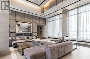 Mississauga (Central Erin Mills) condo for rent - A living room with a large painting on the wall and a coffee table in the center.