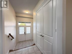Newmarket (Woodland Hill) apartment for rent - A hallway with white doors and a window with a lattice design.