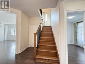Newmarket (Woodland Hill) apartment for rent - A staircase in a house with a wooden handrail and steps.
