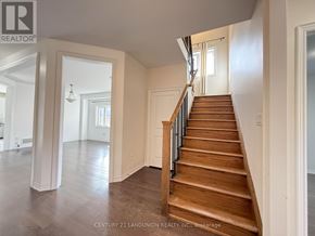 Newmarket (Woodland Hill) apartment for rent - A spacious hallway with a staircase leading to the second floor.