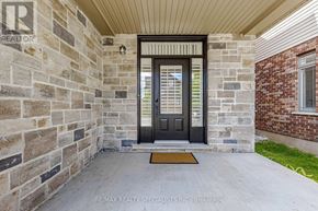 Guelph (Victoria North) apartment for rent - A house entrance with a stone wall and a door.