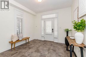 Guelph (Victoria North) apartment for rent - A room with a bench, a table, and a plant.