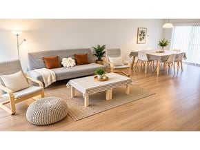Surrey townhouse for rent - A living room with a grey couch, a wooden ottoman, and a dining table set up.