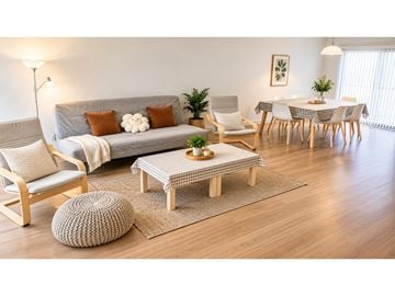 Surrey townhouse for rent - A living room with a grey couch, a wooden ottoman, and a dining table set up.