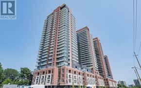 Toronto (Humber Heights) condo for rent - A tall residential building with a clear blue sky in the background.