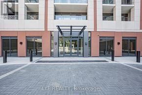 Toronto (Humber Heights) condo for rent - A building entrance with a glass door and a brick wall.