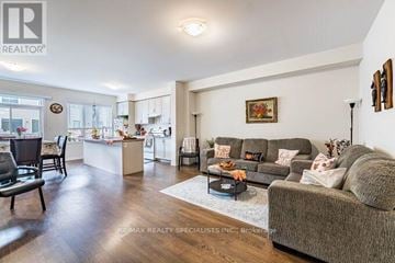 Caledon townhouse for rent - A living room with a grey couch and a coffee table.