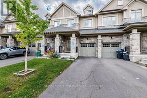 Caledon townhouse for rent - A large, luxurious house with a stone facade and a large driveway.