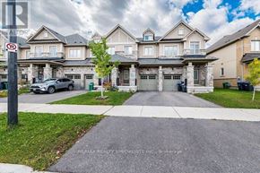 Caledon townhouse for rent - A large, multi-story residential building with a no parking sign in front.