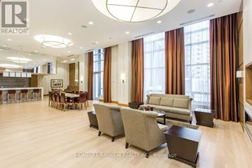 Toronto (Willowdale East) condo for rent - A living room with a grey couch and a coffee table.