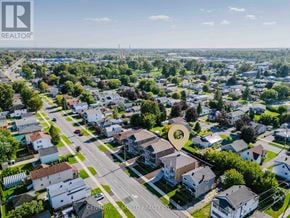 Cornwall triplex for rent - An aerial view of a residential area with houses and streets.