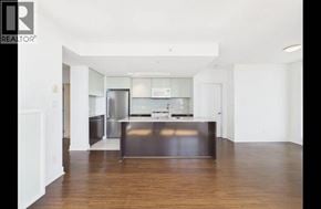 Burnaby apartment for rent - A modern kitchen with a wooden floor and white walls.