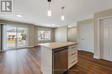 Cornwall triplex for rent - A kitchen with a dishwasher and a countertop.
