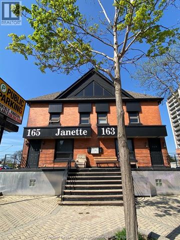 Windsor apartment for rent - A red brick building with the numbers 165 and 163 on it.