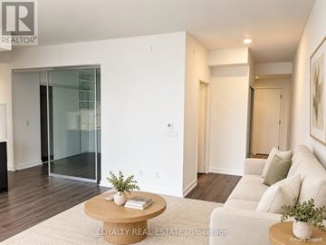 Toronto (Bay Street Corridor) condo for rent - A living room with a white couch and a coffee table.