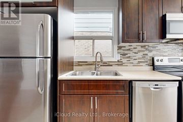 Brampton (Fletcher's West) apartment for rent - A kitchen with a stainless steel refrigerator and a dishwasher.