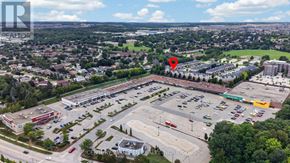 Kitchener townhouse for rent - An aerial view of a parking lot with a red marker indicating a specific area.