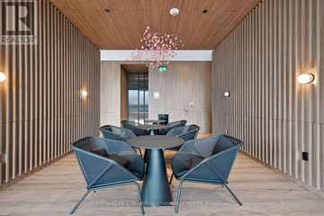 Toronto (Church-Yonge Corridor) condo for rent - A modern dining area with a round table and chairs.