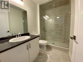 Oakville (Go Glenorchy) condo for rent - A bathroom with a sink, toilet and shower.
