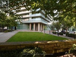Toronto (Willowdale West) condo for rent - A building with a grassy area in front of it.