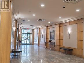 Toronto (Willowdale West) condo for rent - A hallway with a bench and a painting on the wall.