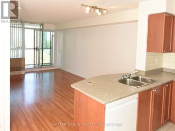 Toronto (Willowdale West) condo for rent - A kitchen with wooden cabinets and a countertop.
