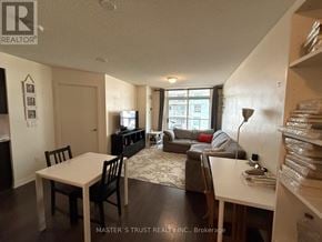Toronto (Dovercourt-Wallace Emerson-Junction) condo for rent - A living room with a couch, a chair, a table, and a television.