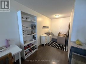 Toronto (Dovercourt-Wallace Emerson-Junction) condo for rent - A bedroom with a bed, nightstand, and a desk with a chair.