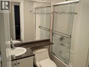 Burnaby apartment for rent - A bathroom with a sink, toilet, and shower.