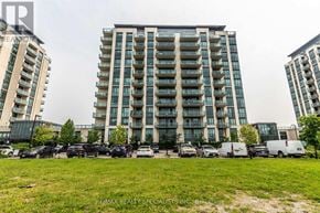Brampton (Goreway Drive Corridor) condo for rent - A large apartment building with a parking lot in front.