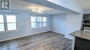 Windsor apartment for rent - A room with a realtor sign on the wall.