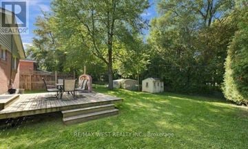 Aurora (Aurora Highlands) apartment for rent - A backyard with a deck and a small shed.