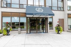 Brampton (Queen Street Corridor) condo for rent - The front of a building with a sign that says "REALTOR" and "12 Laurelcrest Street".
