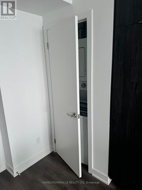 Burlington (Brant) condo for rent - A white door is open to a dark room.