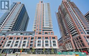 Toronto (Humber Heights) condo for rent - A group of high-rise buildings with the words "REALTY Brokerage" visible on the building in the foreground.