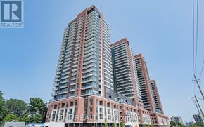 Toronto (Humber Heights) condo for rent - A tall residential building with a clear blue sky in the background.