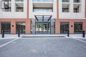 Toronto (Humber Heights) condo for rent - A building entrance with a glass door and a brick wall.
