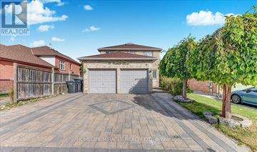 Brampton (Northwood Park) apartment for rent - A real estate image of a house with a driveway and garage.