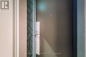 Hamilton (Kirkendall) condo for rent - A glass door with a handle and a sign on it.