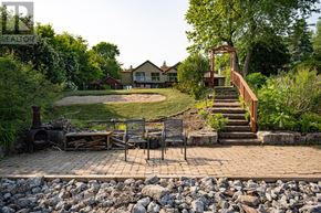 Oakville (Sw Southwest) apartment for rent - A backyard with a patio and a fire pit.