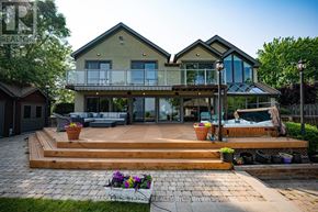 Oakville (Sw Southwest) apartment for rent - A large house with a deck and patio area.