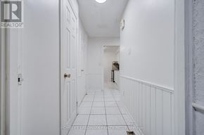 Markham (Milliken Mills West) apartment for rent - A hallway with white walls and a tiled floor.