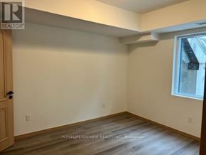 Toronto (L'amoreaux) townhouse for rent - A room with a wooden floor and a window.