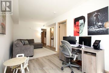 Toronto (L'amoreaux) townhouse for rent - A kitchen with white cabinets and a black stove top oven.
