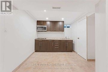 Richmond Hill (North Richvale) apartment for rent - A real estate advertisement showing an empty room with a kitchenette.