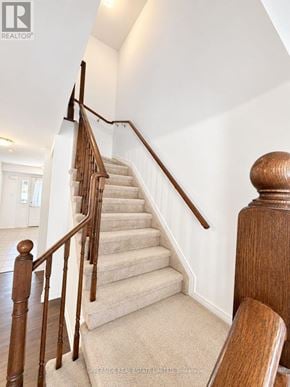 Innisfil (Alcona) townhouse for rent - A staircase with wooden balusters and handrails.