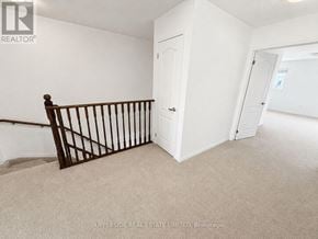 Innisfil (Alcona) townhouse for rent - A room with a white door and a carpeted floor.