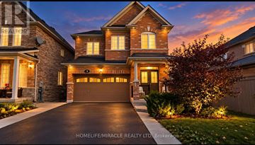Brampton (Sandringham-Wellington) apartment for rent - A large, well-lit house with a driveway in front.